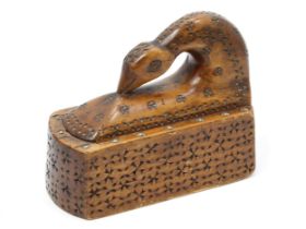 Treen - a 19th century Scandinavian chip-carved table snuff box, the hinged cover as a stylised