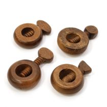 Nutcrackers - a 19th century boxwood ring shaped screw-action pocket nut cracker, 5cm diam;