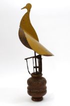 Folk Art - a narrowboat automaton chimney cowl, as a bird, mounted for display on a carved oak base,