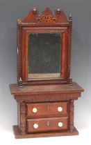 A 19th century tramp art chest, shaped cresting above a rectangular mirror enclosing a secret