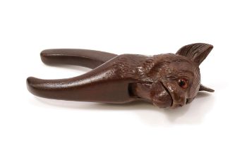 Nutcrackers - a Black Forest lever-action novelty nut cracker, carved as the head of a cat, 16.5cm