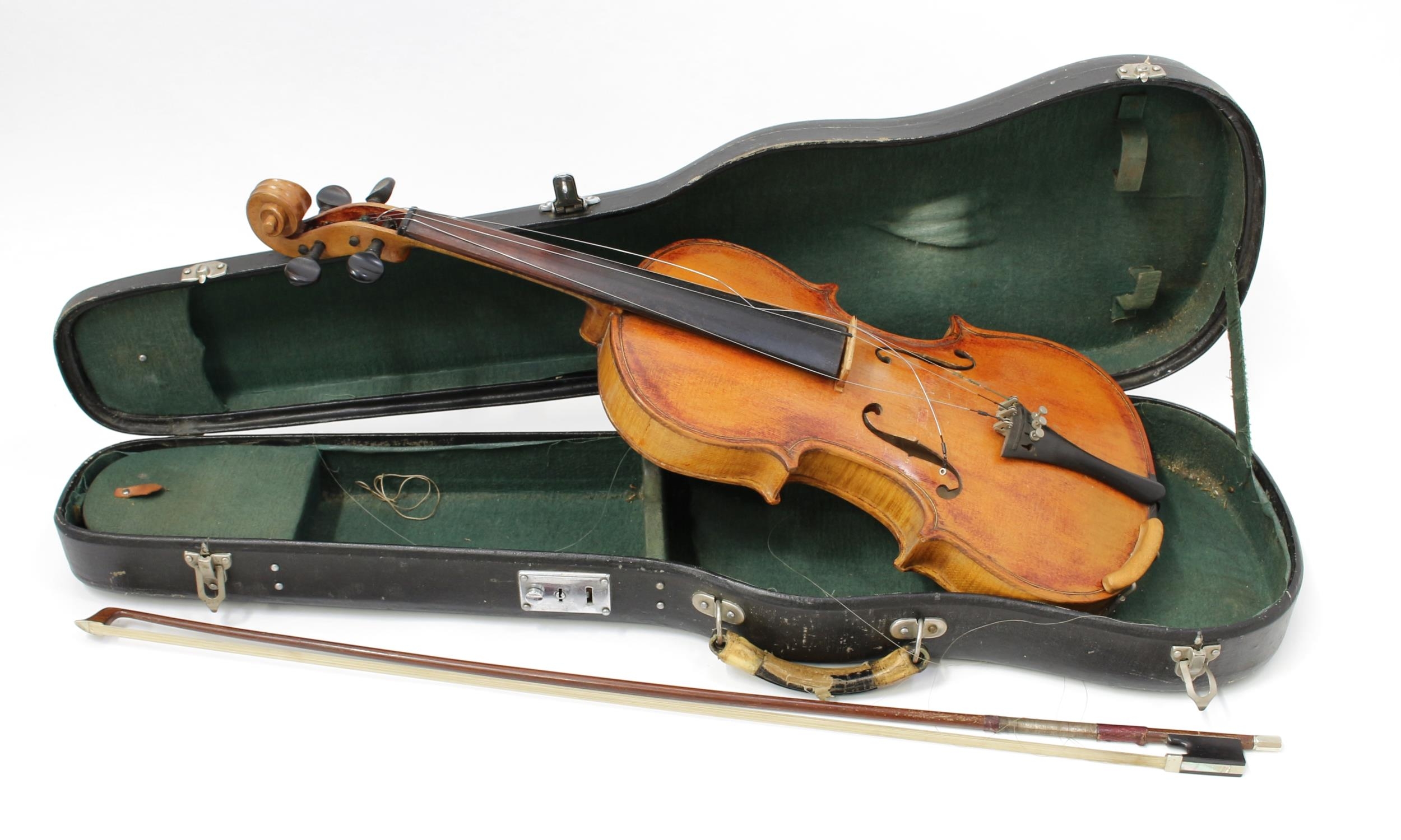 A violin, the two-piece back 36.5cm excluding button, ebonised tuning pegs, outlined throughout with