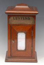 An Edwardian style mahogany novelty country house post box, pagoda top above a brass aperture