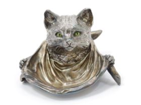 A silver plated novelty inkwell, as a cat wearing a bib, enamel eyes, hinged cover, 13.5cm wide