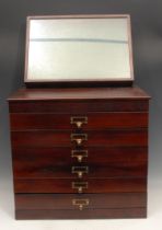 A mahogany table top collector's cabinet, rectangular oversailing top above six drawers, each