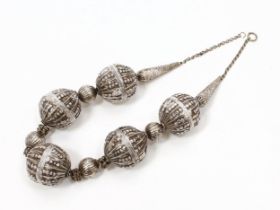 A Middle Eastern silver bead necklace, 61cm long overall, Yemen, early 20th century