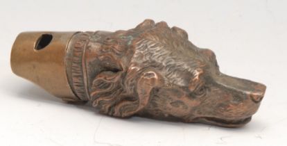 A late 19th century novelty combination vesta case and whistle, as the head of a dog, 9cm long, c.