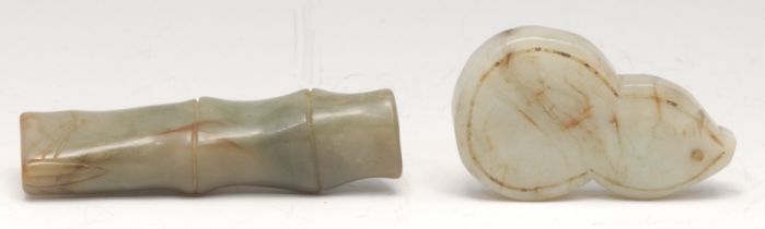 A Chinese jade toggle, carved as a section of bamboo, 8.5cm long; another (2)