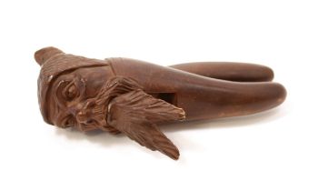 Nutcrackers - a Black Forest lever-action novelty nut cracker, carved as the head of a bearded
