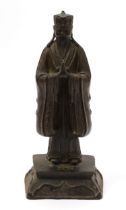 Chinese School (17th/18th century), a dark patinated bronze, of a Daoist Immortal, traces of