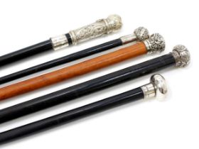 An Edwardian silver mounted walking stick, by Brigg, the domed pommel quite plain, ebonised cane,