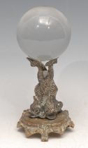 Mysticism and the Occult - a crystal ball, the 19th century stand cast with three dolphins, 20cm