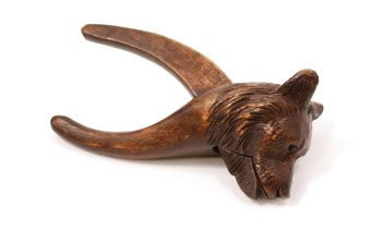 Nutcrackers - a Black Forest lever-action novelty nut cracker, carved as the head of a bear, 15cm