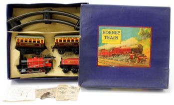 A Hornby O Gauge tinplate M1 passenger train set, comprising clockwork 0-4-0 tank locomotive and