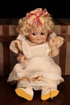 An Armand & Marseille (Germany) bisque head novelty Googly-eyed doll, the bisque head with painted