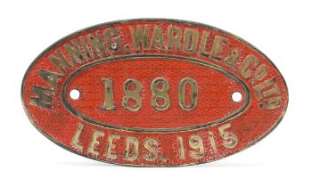 Railwayana - an oval shaped painted cast brass works plate, raised lettering on a red ground, '