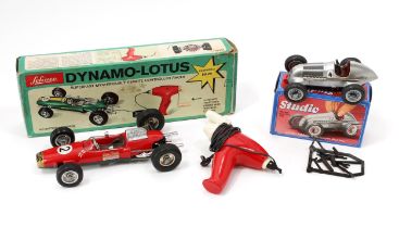 A Schuco (Germany) 1079 Dynamo-Lotus Formula 1 remote controlled racing car, red body with various