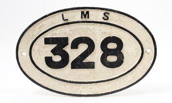 Railwayana - an LMS oval shaped painted cast iron bridge plate, raised black lettering on a white