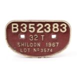 Railwayana - a 'D' shaped painted cast iron wagon plate, raised white lettering on a red/maroon