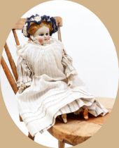 Toys From The Attic Part II - a 19th century unglazed Parian type shoulder head doll, the pale