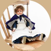 Toys From The Attic Part II - an early 20th century painted composition shoulder head doll, as a