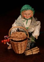 An English bisque shoulder head doll, modelled as a Gypsy, the bisque head with painted features