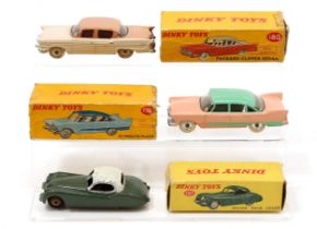 Dinky Toys 157 Jaguar XK120 coupé, drab green body, later painted white roof, tan ridged hubs,