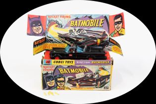 Corgi Toys 267 Rocket Firing Batmobile, black body with black and red Bat decals to side doors,