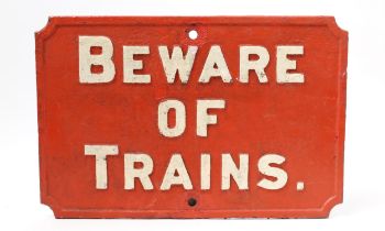 Railwayana - a shaped rectangular painted cast iron sign, raised white lettering on a red ground, '