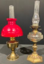 A Victorian brass and cut glass oil lamp, cut glass reservoir, hexagonal column, 62cm high;