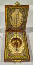 A reproduction 18th century style folding pocket compass and sun dial