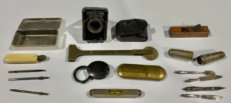 A miniature wood plane; lens; tool kits; etc