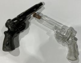 An early 20th century novelty clear glass spirit bottle, modelled as a pistol, with contents, 24cm