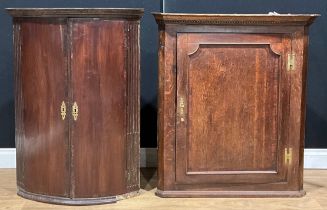 A 19th century oak splay-front corner cabinet, 95.5cm high, 86cm wide, 47cm deep; another, mahogany,