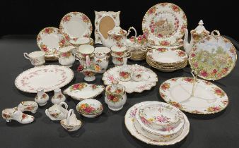 Ceramics - a Royal Albert Country Roses tea, coffee and dinner service, comprising teapot, coffee