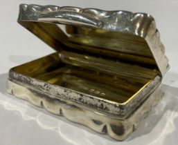 A silver shaped rectangular snuff box, the hinged cover inscribed 'The South Wales Ladies Team To