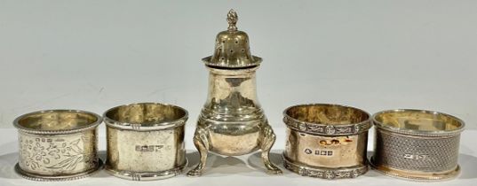 A silver pepper pot, Birmingham 1960; a silver napkin ring, Sheffield 1907; other silver napkin