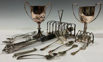 A collection of silver teaspoons, Georgian and later, 97g; a plated toast rack; another; plated