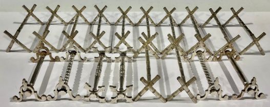 A collection of nine Victorian silver plated pairs of knife rests