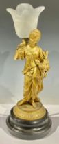 A Victorian gilt spelter lamp, lady holding bird and nest