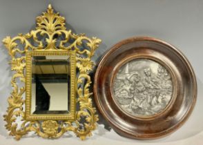 A small Victorian gilt bronze bevelled glass mirror; a circular plaque (2)