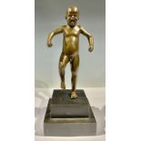 A bronze figure of a boy