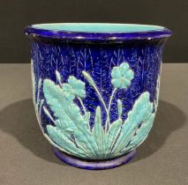 A 19th century Copeland majolica jardiniere, in relief with turquoise primroses and grasses on a