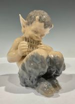 A Royal Copenhagen figure, Faun Playing Pan Flute, model no. 1736, 13.5cm high