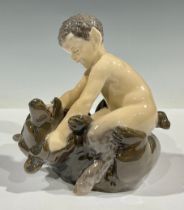 A Royal Copenhagen figure, Faun with Bear, model no. 648, 15cm high