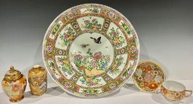 A large Chinese famille rose bowl, decorated in polychrome with insects amongst flowers, picked