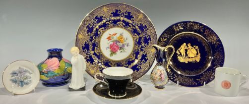 A Moorcroft magnolia pattern compressed ovoid vase; a Caverswall cabinet plate; a Royal Doulton