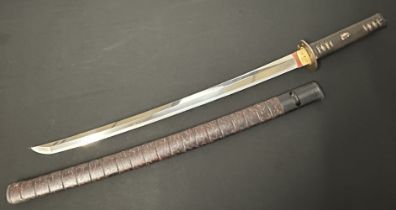 Japanese Sword with single edge blade 562mm in length. Good Hamon line. Tang in unsigned. Fish