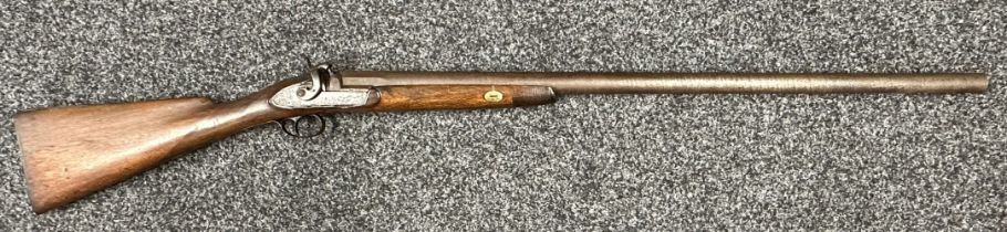 A single barrel percussion cap shotgun with 825mm long barrel. Bore approx. 23mm. Action holds at