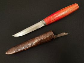 Finnish Puukko Knife with single edged blade 100 mm in length. No makers marks. Red wood handle.